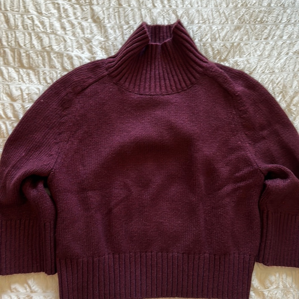 Soft wine color sweater with slight sparkle thread throughout